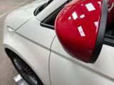 a close up of a car ' s side mirror with a sticker on it