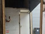 a man taking a picture of a mirror in a room