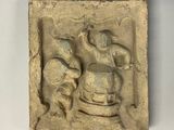 une image représentant un relief en pierre représentant un homme et une femme
