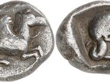 a close up of a coin with a horse and a man on it