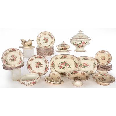 many different types of dishes and bowls on this table