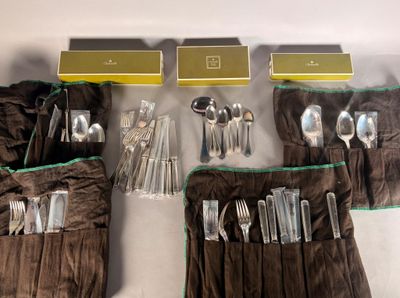 a lot of silverware in a bag on the table