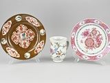 two plates and a cup are sitting on a table