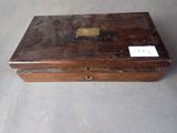 a small wooden box that has a label on it