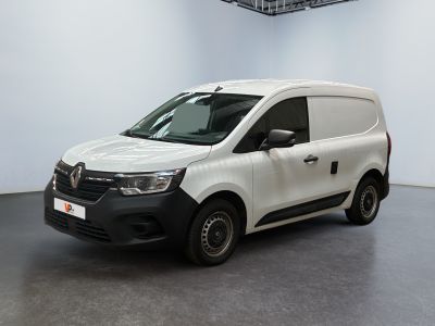 the white van is parked in a white room with a black floor