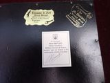 a black box with a label on it that has a picture of a bird on it