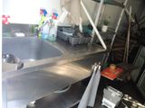an image of a kitchen with a sink and shelves