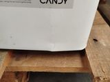 a box of candy sitting on top of a wooden pallet