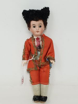 Poupée garçon en costume de torero, tête de porcelaine, yeux…
