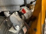 a close up of the engine of a construction vehicle