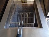 an image of a fryer that has a basket in it