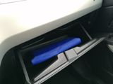 a blue object in the center of a car ' s console