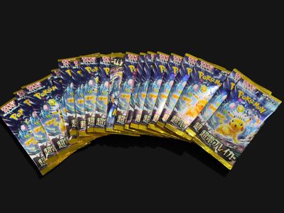 a bunch of pokemon cards sitting on top of each other