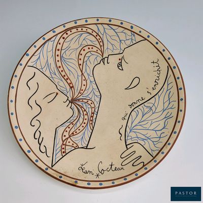 a plate with a drawing of a woman on it