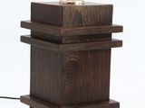 a lamp that is sitting on top of a wooden table