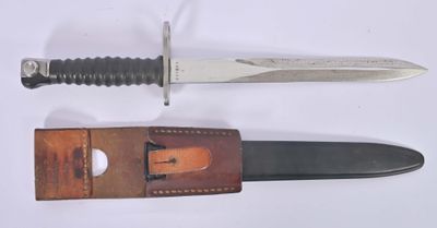 two different types of knives on a white surface