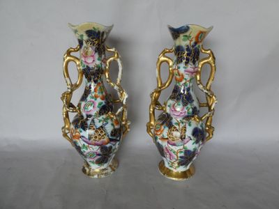 two vases that have been decorated with flowers on them