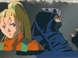 Deux personnages d'anime se tiennent côte à côte devant une fenêtre.