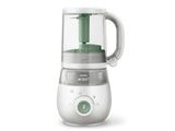 Le robot culinaire pour bébé est blanc et possède une poignée verte.