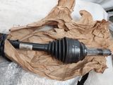 a broken steering shaft on a piece of paper on a bed