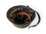 an old military helmet with a leather strap on a white background