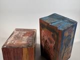 two wooden blocks sitting next to each other on a table