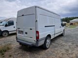 a white van that is parked in the dirt