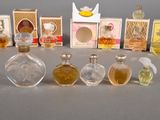 a lot of perfume bottles that are sitting on a table