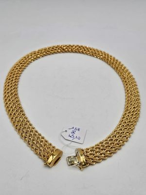 a gold chain bracelet with two charms on it