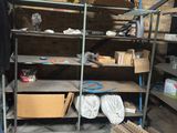 a room with a lot of shelves and a lot of boxes