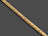 un bracelet en or jaune 18 carats au motif tressé