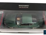 the box is open to show the model of a green sports car