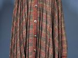 a brown and red plaid cape on a mannequin mannequin mannequin mannequin mannequin mannequin mannequin mannequin