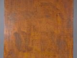 an old wooden box sitting on top of a gray surface
