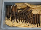 a lot of tools in a box on the floor
