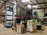 a large warehouse filled with lots of boxes and pallets
