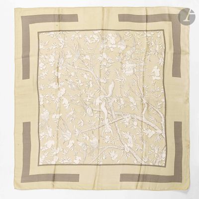 a beige and brown square scarf with birds and flowers on it
