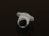 a close up of a ring on a table with a black background