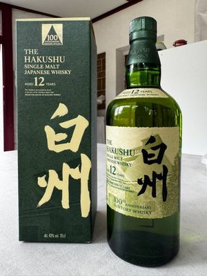an image of a bottle of japanese whisky next to a box