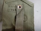 a close up of a military uniform with a button on it