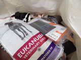 a pile of clothing that is sitting on the floor