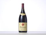 a bottle of red wine sitting on top of a table