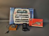 a box with a train set and a remote control