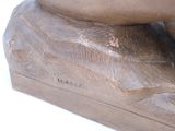a close up of a statue of a person on a skateboard