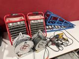 two air compressors sitting on a table next to a pile of wires