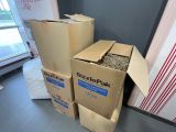two boxes are stacked on top of each other in a room