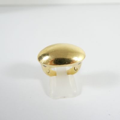 an image of a gold plated ring on a white surface