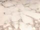 a marble counter top with a bowl of food on it