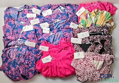 a lot of clothes that are sitting on a table