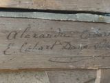 a piece of wood that has writing on it